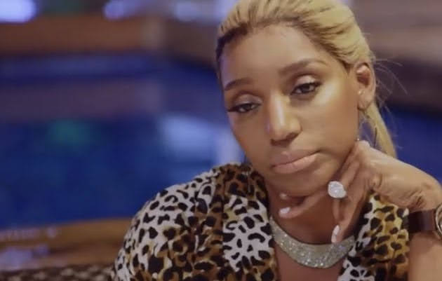 Bored social media user after scrolling past unengaging content on her phone